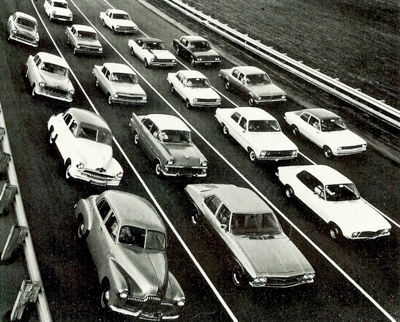 GM Holden publicity shot circa 1973, showing the original 48/215 in foreground, with HQ at right